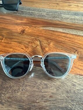 Prada Transparent Frame Sunglasses with Dark Lenses